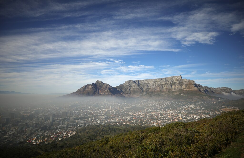 Seasonal fog disapates over the city beneath Table Mountain in Cape Town, South Africa, June 12,2021. REUTERS/Mike Hutchings - RC2YYN9T5LLQ