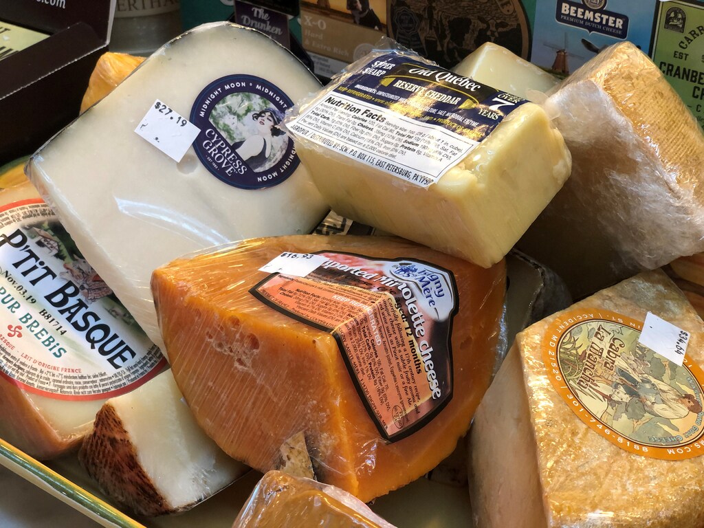 Imported European cheeses are seen on display at the Bowers Fancy Dairy Products shop in Washington's Eastern Market several weeks before the Trump administration's tariffs on European Union cheeses are set to kick in across the country and in Washington, U.S. October 3, 2019. Picture taken October 3, 2019. REUTERS/Kevin Fogarty - RC1E7885CCE0