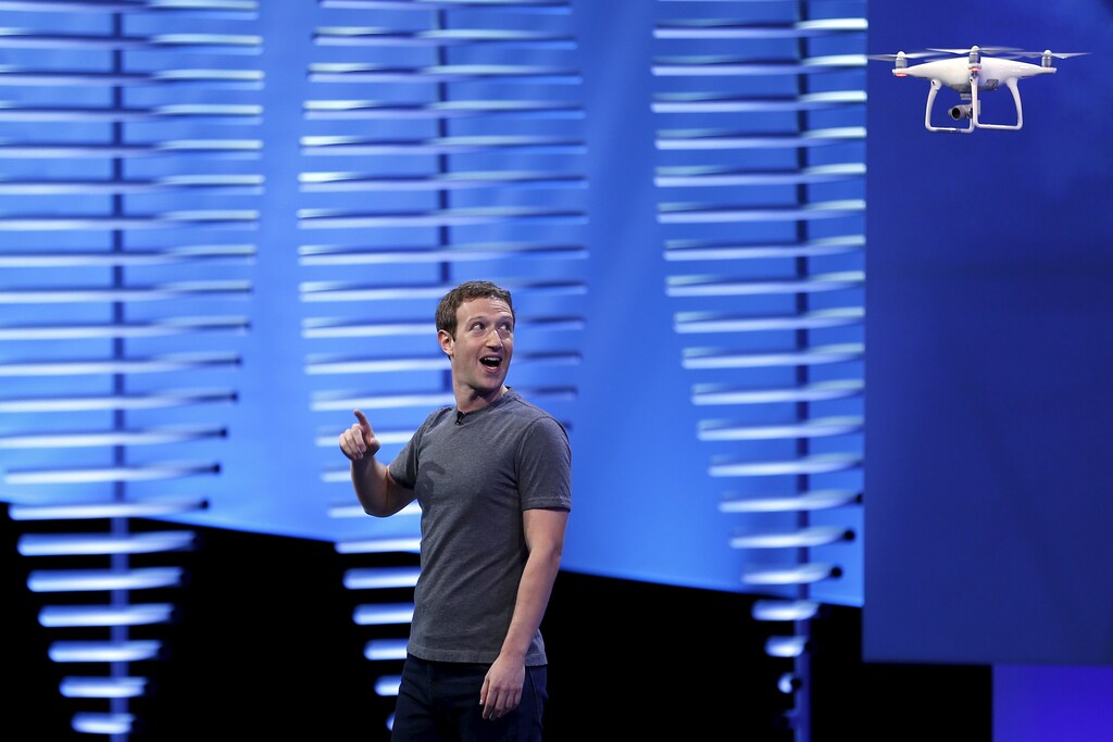 Facebook CEO Mark Zuckerberg looks at a flying drone on stage during the Facebook F8 conference in San Francisco, California April 12, 2016. REUTERS/Stephen Lam - RTX29NQ1