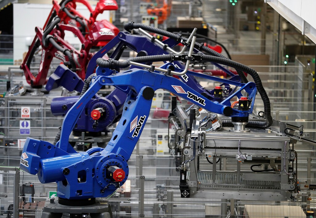 Robots work on the production line at AkzoNobel's new paint factory in Ashington, Britain September 12, 2017. REUTERS/Phil Noble
