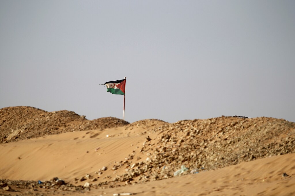 The Sahrawi Arab Democratic Republic flag flies in Boudjdour desert refugee camp in Tindouf, southern Algeria March 4, 2016. In refugee camps near the town of Tindouf in arid southern Algeria, conditions are hard for indigenous Sahrawi residents. Residents use car batteries for electricity at night and depend on humanitarian aid to get by. The five camps near Tindouf are home to an estimated 165,000 Sahrawi refugees from the disputed region of Western Sahara, according to the United Nations refugee agency UNHCR. REUTERS/Zohra Bensemra SEARCH "THE WIDER IMAGE" FOR ALL STORIES Matching text ALGERIA-SAHARA/ - RTS9CBB