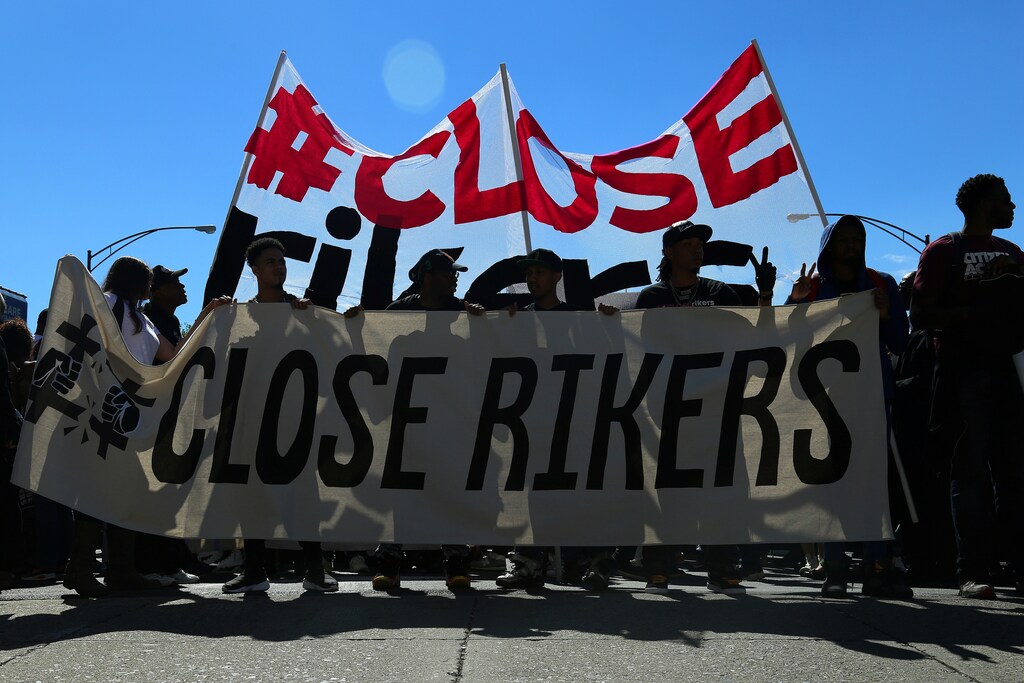 People attend a protest march to shut down Rikers Island prison in the Queens borough of New York, U.S., September 24, 2016. REUTERS/Bria Webb - S1AEUDFVPEAA
