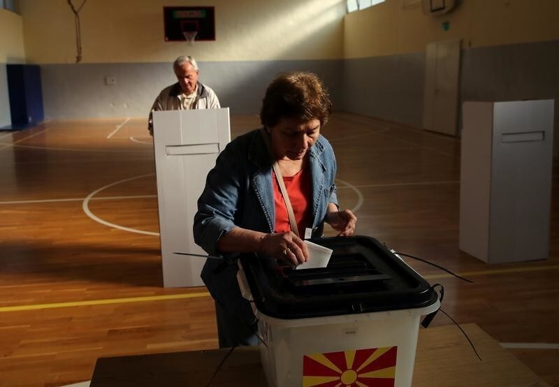 A woman casts her ballot for the referendum in Macedonia on changing the country's name that would open the way for it to join NATO and the European Union in Skopje, Macedonia September 30, 2018