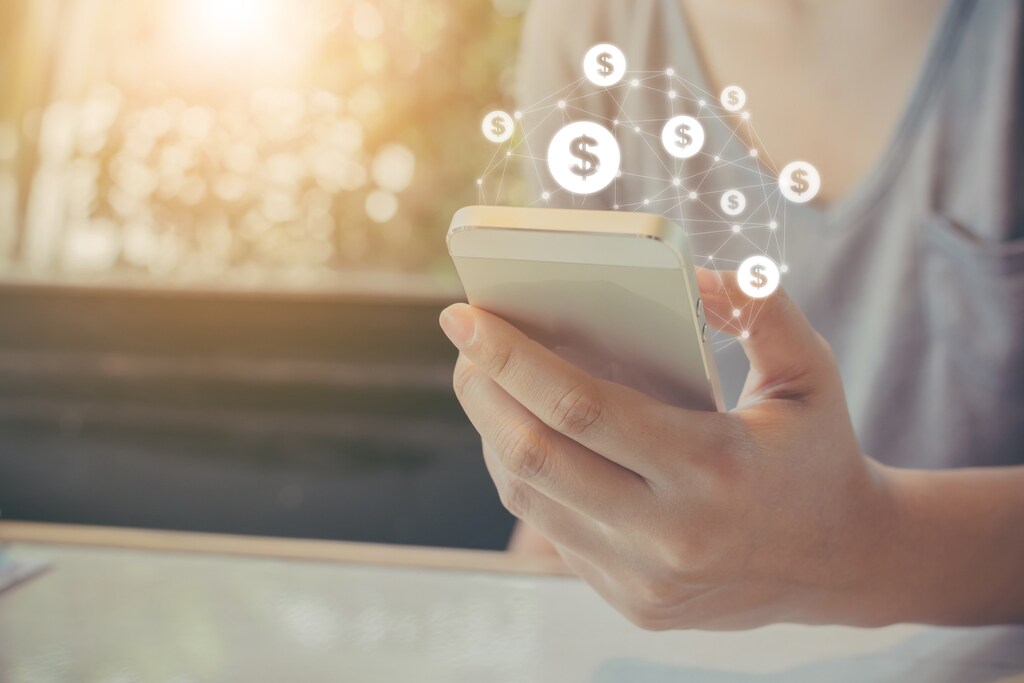 Asian woman hand using mobile phone with online transaction application, Concept e-commerce and internet investment
