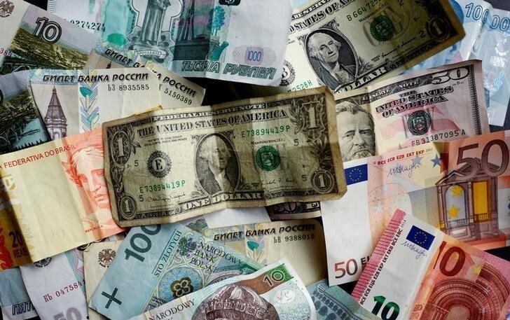 Bank notes of different currencies, including Euro, U.S. Dollar, Turkish Lira or Brazilian Reais, are photographed in Frankfurt, Germany, in this illustration picture taken May 7, 2017. Picture taken May 7, 2017. REUTERS/Kai Pfaffenbach/Illustration