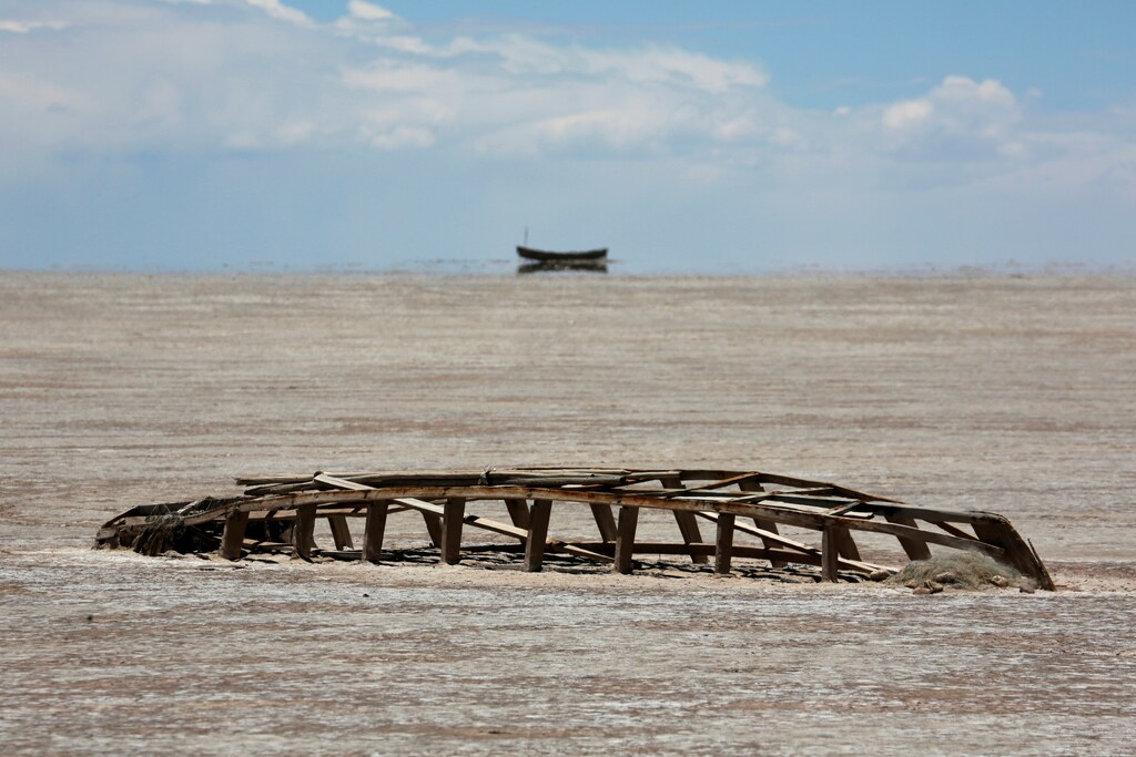A carcase of a boat is seen on the dried lake Poopo affected by climate change, in the Oruro Department, Bolivia, December 16, 2017. Picture taken December 16, 2017. REUTERS/David Mercado - RC19D4485190