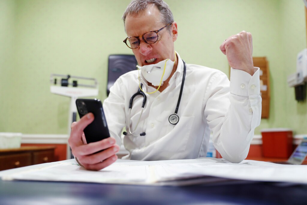 Dr Greg Gulbransen takes part in a telemedicine call with a patient while maintaining visits with both his regular patients and those confirmed to have the coronavirus disease (COVID-19) at his pediatric practice in Oyster Bay, New York, U.S., April 13, 2020. Picture taken April 13, 2020.
