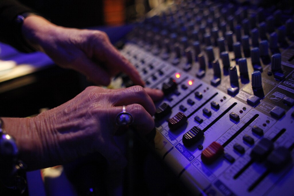 DJ Wika Szmyt controls the sound mixer as she plays music at a club in Warsaw January 4, 2012. Szmyt, 73, spends her retirement days behind a DJ console watching people dance to her rhythms. She plays disco, rumba or samba for a mostly elderly audience because she feels she is giving them a new take at life. DJ Wika plays in a Warsaw club three days a week but has also been involved in other musical projects, including parties where she plays for a younger and more demanding audience. REUTERS/Kacper Pempel (POLAND - Tags: SOCIETY ENTERTAINMENT) - GM1E8150LMR01