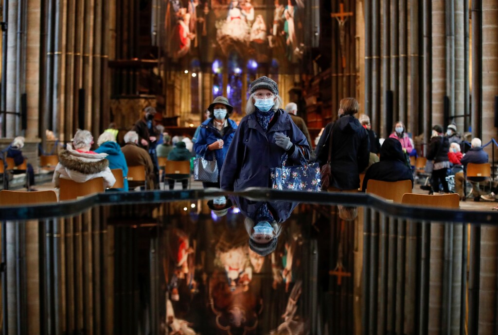 People wearing masks getting Covid vaccinations in Salisbury Cathedral