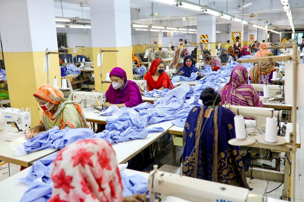 Women work in a garment factory, as factories reopened after the government has eased the restrictions amid concerns over the coronavirus disease (COVID-19) outbreak in Dhaka, Bangladesh, May 3, 2020. REUTERS/Mohammad Ponir Hossain - RC2WGG9QY1S6