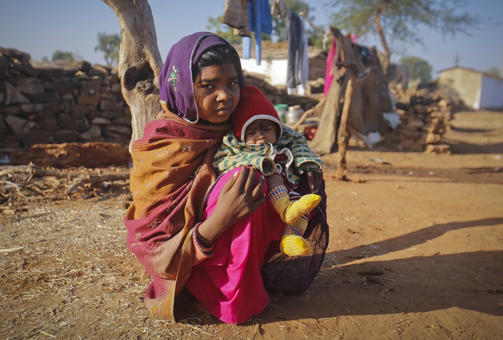 Krishna, 14, sits with her four-month-old baby Alok, outside her house in a village near Baran, located in the northwestern state of Rajasthan, January 21, 2013. Krishna married her husband Gopal when she was 11 and he was 13. Krishna had a very difficult delivery, losing lots of blood and remained in the hospital for several days. The legal age for marriage in India is 18, but marriages like these are common, especially in poor, rural areas where girls in particular, are married off young. Picture taken January 21, 2013. REUTERS/Danish Siddiqui (INDIA - Tags: SOCIETY)ATTENTION EDITORS: PICTURE 2 OF 23 FOR PACKAGE 'TEEN BRIDE HAS FIRST CHILD'SEARCH 'TEEN BRIDE' FOR ALL IMAGES - RTR3CX6R
