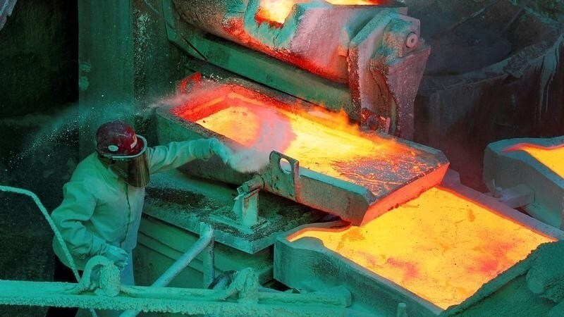 A worker monitors a process inside the plant at the copper refinery of Codelco Ventanas in Ventanas city, northwest of Santiago January 7, 2015.