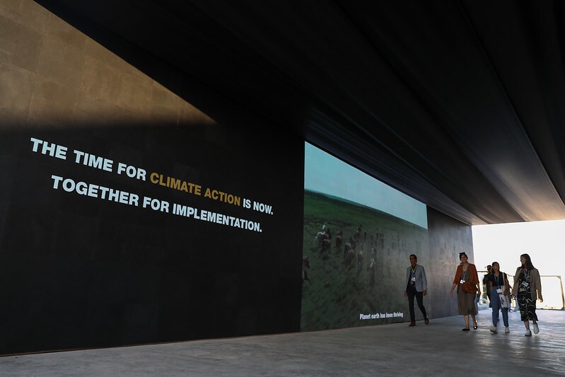 This image shows delegates walking around the COP27 campus, where the First Movers Coalition is meeting