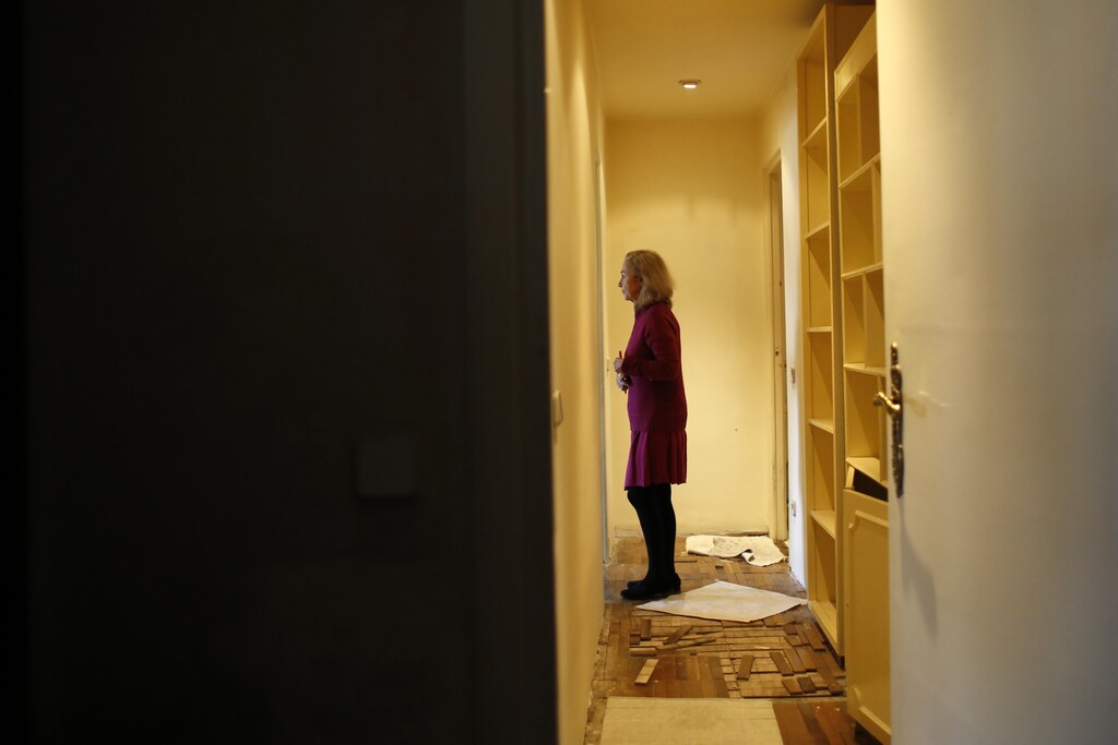 Monica Briceno stands in her apartment before learning that her eviction has been postponed in Madrid April 5, 2013. Briceno is a 70 year-old separated woman living on a pension of 364.90 euros ($475) and suffering from Alzheimer's disease. She has an advanced cognitive impairment and an eviction from what was her home for the last 40 years could cause irreparable damage. Clinical studies prove that to remove an Alzheimer patient from her usual place of residence and routines can accelerate the progress of the disease. She's been living in a cheap rental apartment (old rental system) in Madrid since 1974. In 2001, after her legal separation, a judge gave her single tenancy rights. She has always complied with her payment obligations but the homeowner now claims the house for personal use. Authorities have postponed her eviction until the 24th of May, while her unemployed son Christian tries to relocate her through social services to a place where she can be properly taken care off. REUTERS/Juan Medina
