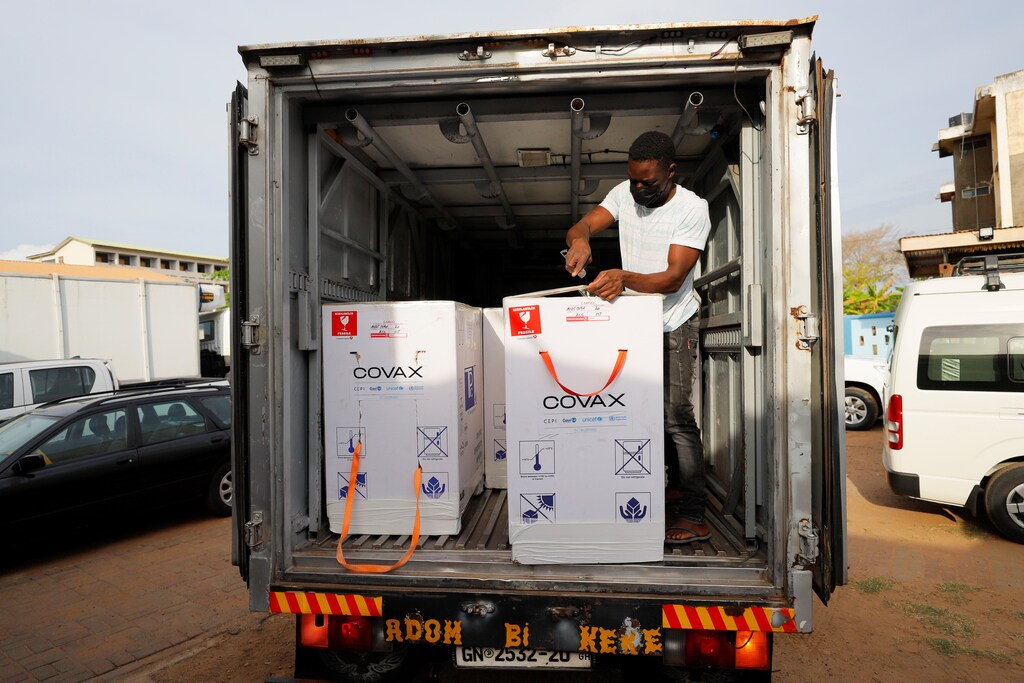Boxes of Oxford/AstraZeneca coronavirus disease (COVID-19) vaccines, redeployed from the Democratic Republic of Congo, are seen loaded onto a refrigerated delivery truck in Accra, Ghana, May 7, 2021. REUTERS/Francis Kokoroko - RC2VAN96JL50