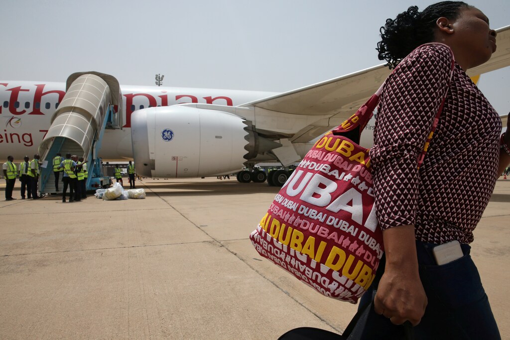 A passenger walks past an Ethiopian airlines plane at the newly opened Kaduna international airport in Kaduna, Nigeria March 8, 2017. REUTERS/Afolabi Sotunde - RC16009D78A0