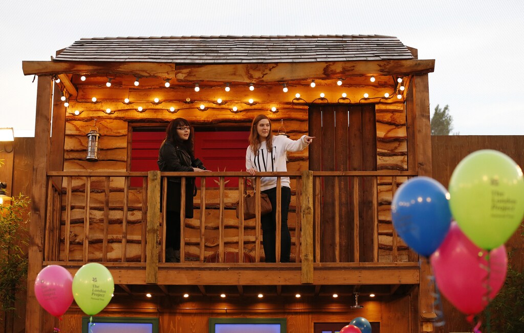 Visitors look at the view from the tree house in the Big Brother house in Elstree, Hertfordshire, which the National Trust will open to the public for two days this weekend, September 26, 2013. The National Trust will open the house to the public as part of their series called the London Project. REUTERS/Olivia Harris (BRITAIN - Tags: SOCIETY ENTERTAINMENT) - GM1E99R0DDO01