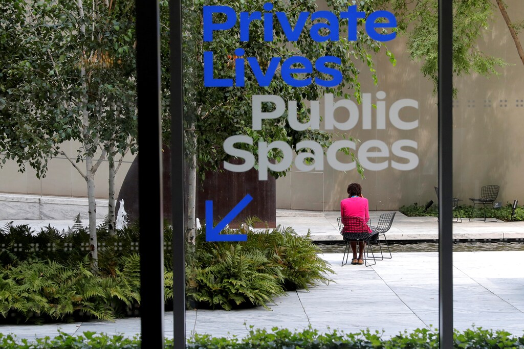 A guest sits in the Abby Aldrich Rockefeller Sculpture Garden inside the Museum of Modern Art (MoMA) one day before the Museum's opening to the general public after being closed since March, following the outbreak of the coronavirus disease (COVID-19), in Manhattan in New York City, New York, August 26, 2020. REUTERS/Mike Segar - RC2XLI9X9SP3