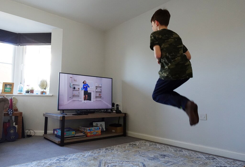 Henry Oliver (10) takes part in a youtube P.E. class run by Joe Wicks at their home in East Grinstead, as the spread of the coronavirus disease (COVID-19) continues, in East Grinstead, Coronavirus china virus health healthcare who world health organization disease deaths pandemic epidemic worries concerns Health virus contagious contagion viruses diseases disease lab laboratory doctor health dr nurse medical medicine drugs vaccines vaccinations inoculations technology testing test medicinal biotechnology biotech biology chemistry physics microscope research influenza flu cold common cold bug risk symptomes respiratory china iran italy europe asia america south america north washing hands wash hands coughs sneezes spread spreading precaution precautions health warning covid 19 cov SARS 2019ncov wuhan sarscow wuhanpneumonia pneumonia outbreak patients unhealthy fatality mortality elderly old elder age serious death deathly deadly