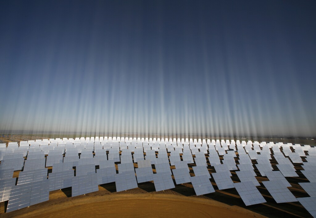A general view shows a "solucar" solar park in Sanlucar La Mayor, near Seville, in this November 6, 2008 file photo. So far, wind turbines are not Sputnik. But one day they could be. The global race to develop clean technology is not just about who can build the best solar parks or wind farms. It is also shaping up as a contest between Chinese-style capitalism and the more market-oriented approach fancied by the United States and Europe. To match special report DAVOS/GREEN REUTERS/Marcelo del Pozo/Files (SPAIN - Tags: ENERGY BUSINESS SOCIETY SCI TECH) - GM1E61S0N5L01