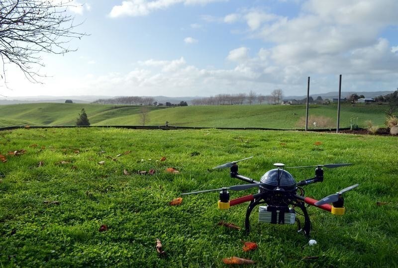 An Aeronavics drone sits in a paddock near the town of Raglan, New Zealand, July 6, 2015. Deep in New Zealand's dairying heartland, drone maker Aeronavics tests aircraft designed to corner the fast-growing emerging market for unmanned aerial vehicles in the film and television business. The developer of drones used in the production of "Dr. Who" and the "Twilight" films is one of a stable of New Zealand firms that are using the country's reputation for innovation in the film industry to stake out claims to what is expected to be a drone boom in Hollywood. The relaxation of U.S. rules for commercial drones late last year has sparked a race to develop specialised flying camera platforms for studios to hire for a fraction of the cost of jibs, cranes or even helicopters to capture swooping aerial shots. Picture taken July 6, 2015. REUTERS/Naomi Tajitsu - GF10000164426