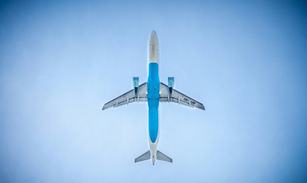 Low angle photography of blue airplane: China is emerging as a major player in sustainable aviation fuel (SAF)