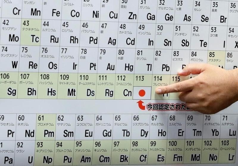 Kyushu University professor Kosuke Morita, head of a team of scientists who discovered element 113, points to the superheavy synthetic element on a periodic table at a news conference at the RIKEN institute's research centre in Wako, Saitama Prefecture, Japan, in this photo taken by Kyodo on June 9, 2016.