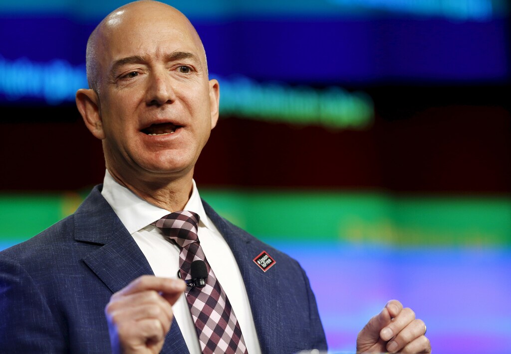Jeff Bezos, owner of The Washington Post, delivers remarks at the grand opening of the Washington Post newsroom in Washington January 28, 2016. REUTERS/Gary Cameron - RTX24G32