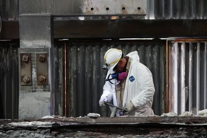 A worker is seen inside the Magnitude 7 Metals LLC aluminium smelter which is reopening and taking on hundreds of local workers in New Madrid, Missouri, U.S., May 3, 2018. Picture taken May 3, 2018. Picture taken May 3, 2018. REUTERS/Karen Pulfer Focht