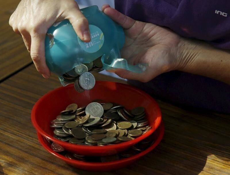 Donations collected from piggy banks for Taiwan's Democratic Progressive Party (DPP) campaign fund are counted at the party headquarters in Taipei, Taiwan, January 9, 2016.