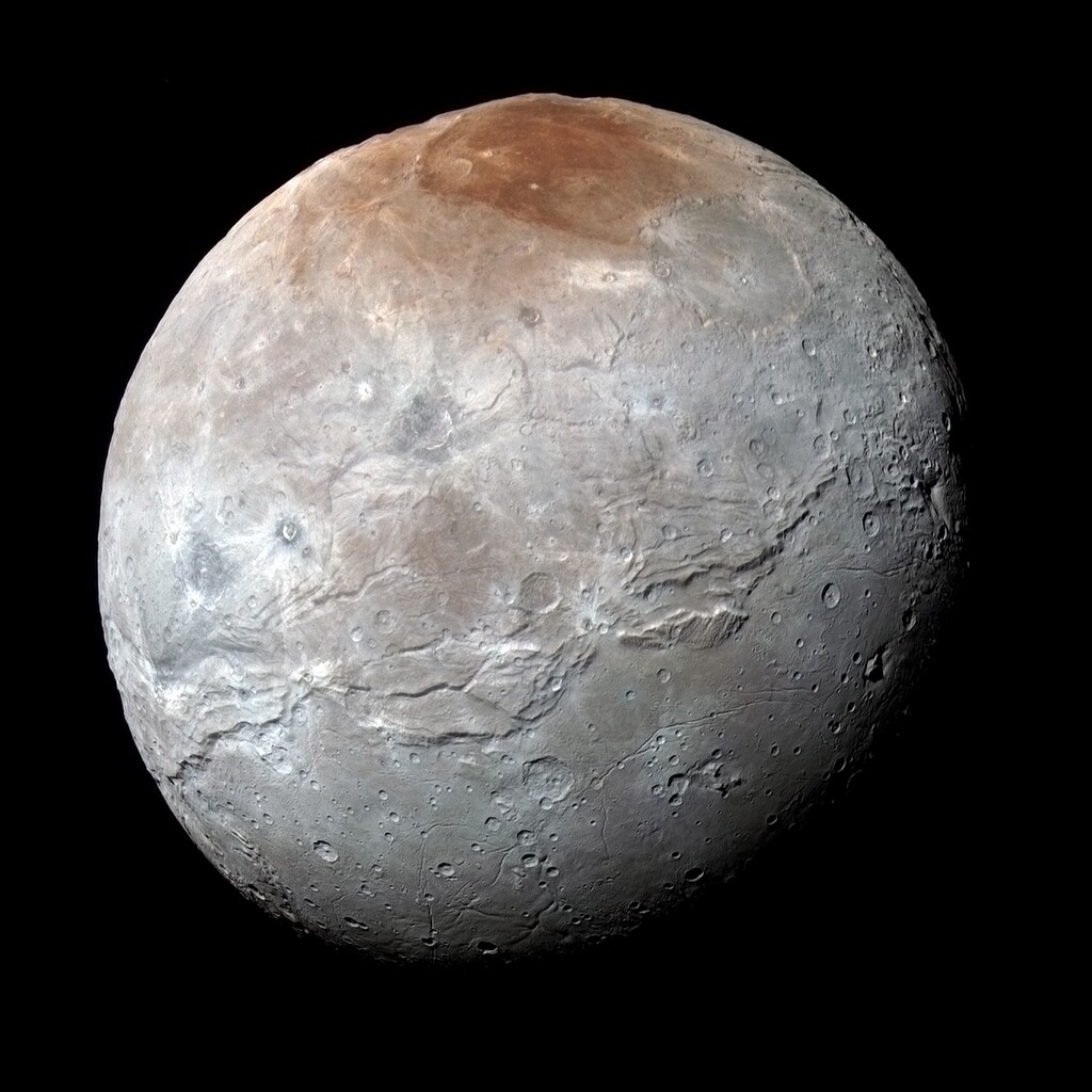 Plutos largest moon, Charon, is seen in a high-resolution, enhanced color view captured by NASA's New Horizons spacecraft on July 14, 2015 and released September 15, 2016. Scientists have learned that reddish material in the north (top) polar region is chemically processed methane that escaped from Plutos atmosphere onto Charon. NASA/JHUAPL/SwRI/Handout via Reuters THIS IMAGE HAS BEEN SUPPLIED BY A THIRD PARTY. IT IS DISTRIBUTED, EXACTLY AS RECEIVED BY REUTERS, AS A SERVICE TO CLIENTS. FOR EDITORIAL USE ONLY. NOT FOR SALE FOR MARKETING OR ADVERTISING CAMPAIGNS - RTSNWWX