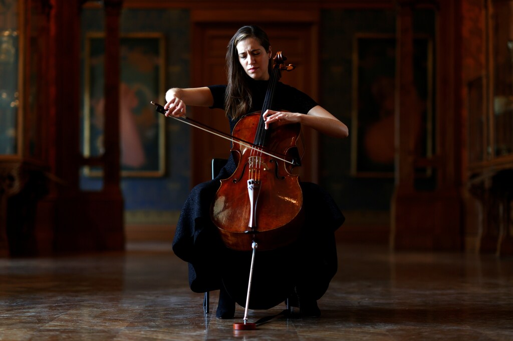 French-Belgian cellist Camille Thomas plays at the Musee des Arts Decoratifs, which is closed to visitors during the lockdown due to the spread of the coronavirus disease (COVID-19), in Paris, France, November 26, 2020. Picture taken November 26, 2020. REUTERS/Christian Hartmann - RC2NBK9JCXV3