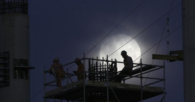 Labourers work at night on the reconstruction of the Mane Garrincha National Stadium, which is being prepared to host matches during the 2014 World Cup, in Brasilia March 7, 2012. FIFA president Sepp Blatter will meet Brazilian president Dilma Rousseff to clear the air after FIFA general secretary Jerome Valcke's remarks about the country's slow progress in preparing for the 2014 World Cup caused an uproar. Valcke was due to visit South America next week but his tour of construction sites in some World Cup host cities has been put back until Blatter and Rousseff have met, a FIFA statement added. Picture taken March 7, 2012.