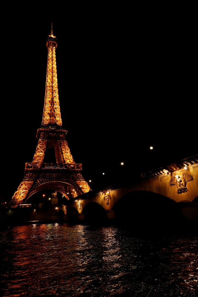 The Eiffel Tower is pictured before Earth Hour in Paris, France, March 25, 2017 at which lights are switched off around the world at 8:30 p.m. on Saturday evening to mark the 10th annual Earth Hour and to draw attention to climate change. REUTERS/Philippe Wojazer - RTX32PTN