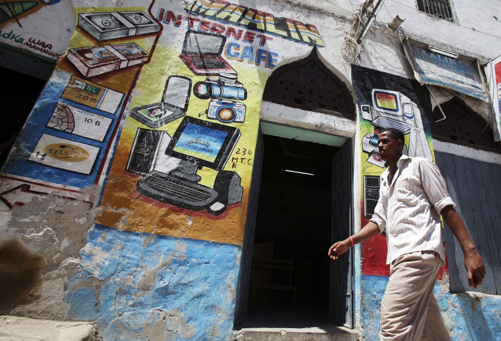 A man walks past an Internet cafe in Hamarweyne district of Somalia's capital Mogadishu, May 16, 2012.