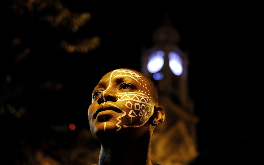 A demonstrator with face paint takes part in a protest by black and indigenous women against racism and machismo in Sao Paulo, Brazil, July 25, 2017. REUTERS/Nacho Doce TPX IMAGES OF THE DAY - RTX3CWPX