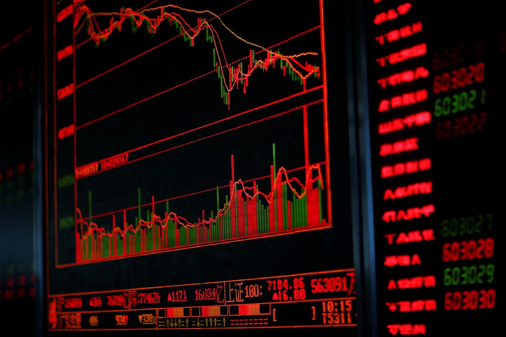A digital board displays stock information at a brokerage office in Beijing, China, December 7, 2018. REUTERS/Thomas Peter - RC1BA2535480