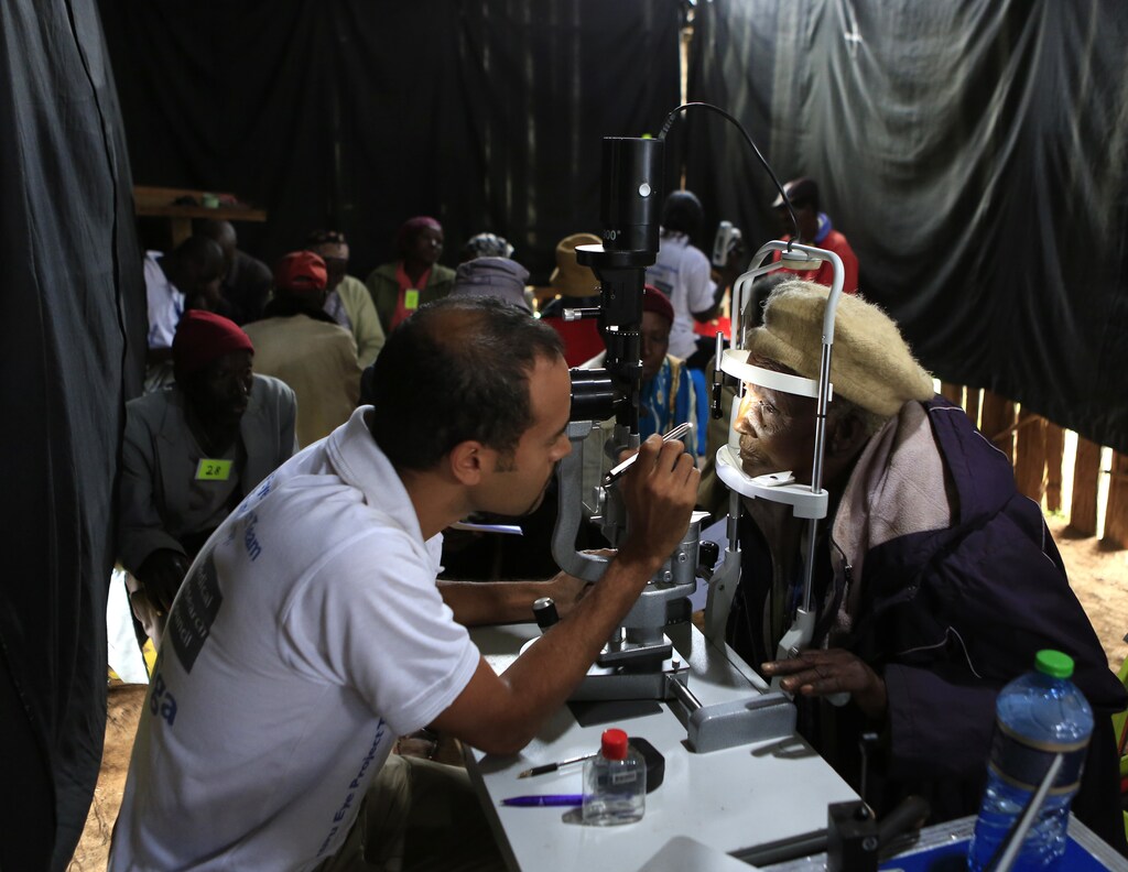 Andrew Bastawrous, an eye specialist, examines a patient at a temporary clinic by International Centre for Eye Health at Olenguruone in the Mau Summit 350km (217 miles) west of Kenya's capital Nairobi, October 29, 2013.