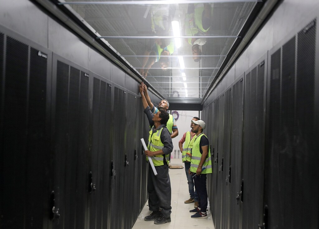Engineers install server cabinets at an under construction data center in the New Administrative Capital (NAC) east of Cairo, Egypt July 5, 2021. Picture taken July 5, 2021. REUTERS/Mohamed Abd El Ghany