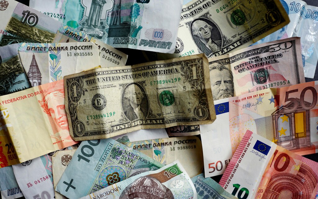 Bank notes of different currencies, including Euro, U.S. Dollar, Turkish Lira or Brazilian Reais, are photographed in Frankfurt, Germany, in this illustration picture taken May 7, 2017. Picture taken May 7, 2017. REUTERS/Kai Pfaffenbach/Illustration - RTX3683Y