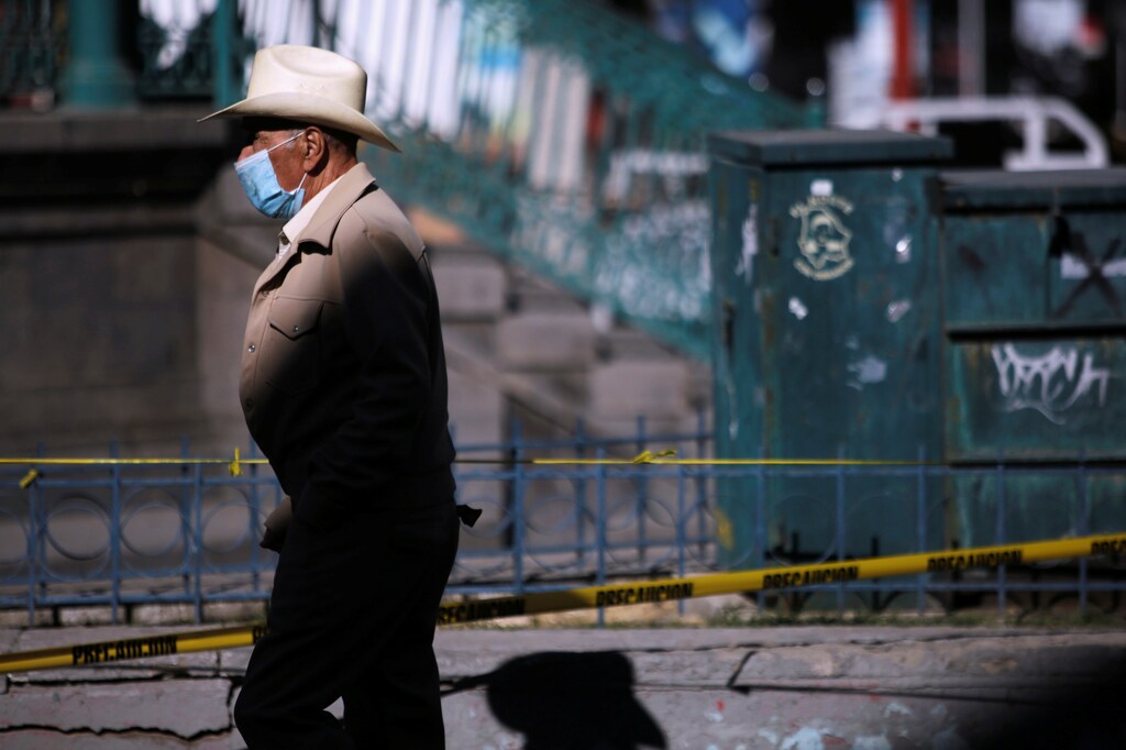 A man wearing a protective face mask walks in downtown Ciudad Juarez, Mexico.
