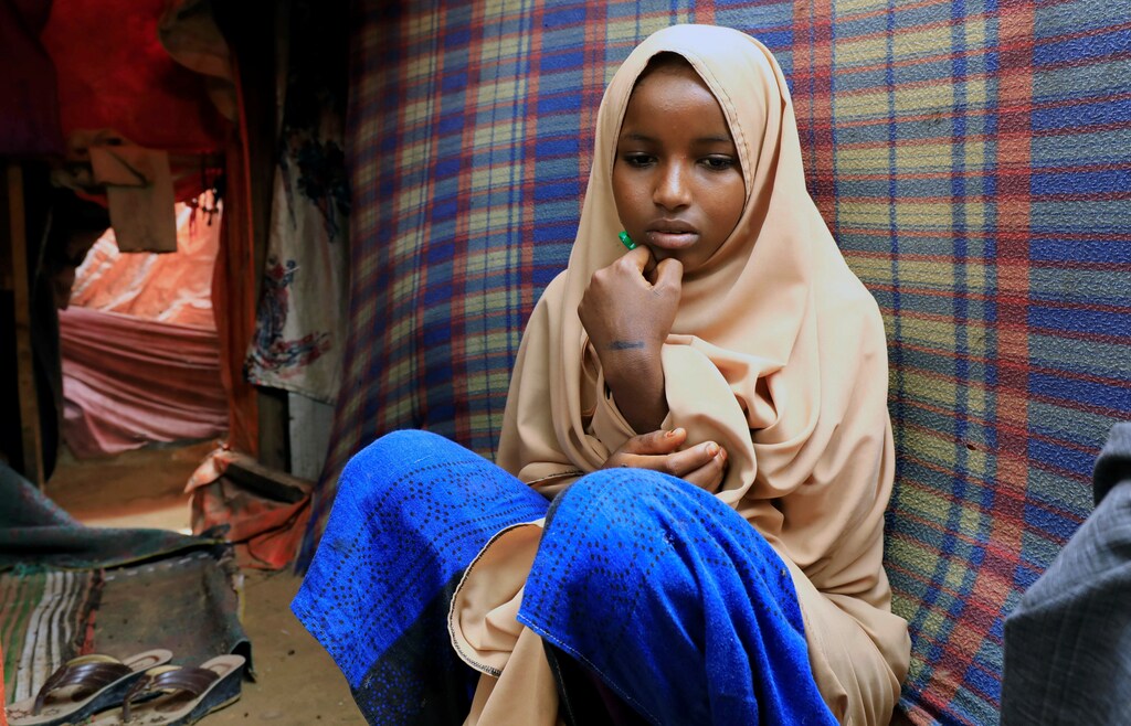 Nurta Mohamed, 13, a Somali girl sits inside her mother's makeshift shelter after she ran away from a suspected forced marriage at the Alafuuto camp for internally displaced persons in Garasbaaley district of Mogadishu, Somalia August 14, 2020. Picture taken August 14, 2020. REUTERS/Feisal Omar