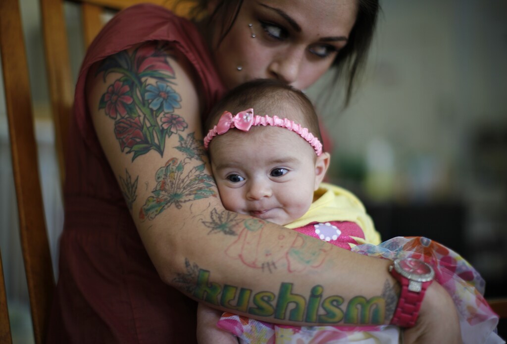 Vanessa Moreno, 24, holds her two-month-old baby Makayla at Prototypes residential treatment program in Pomona, California, March 26, 2013.
