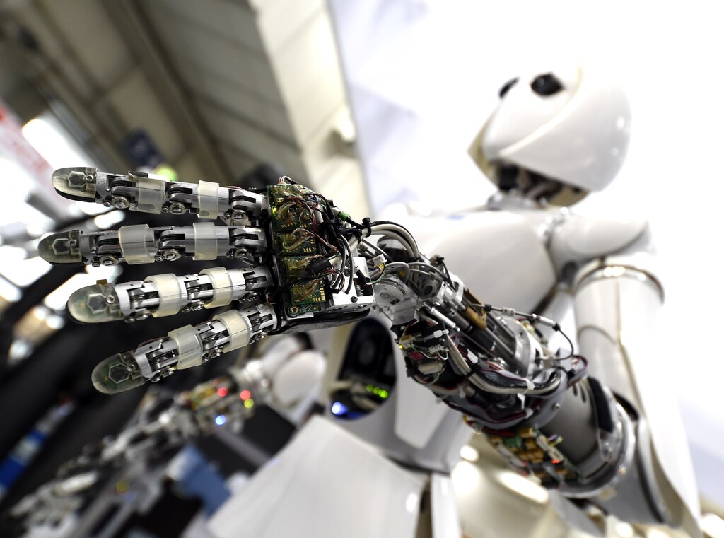 A robot is displayed at the Robotics Innovation Center booth during preparations at the CeBit computer fair, which will open its doors to the public on March 20, at the fairground in Hanover, Germany, March 18, 2017. REUTERS/Fabian Bimmer - LR1ED3I14CE13