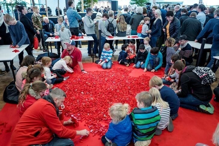 Adults and children play with Lego bricks during the celebrations of the 60th anniversary of the Lego brick, at Lego House in Billund, Denmark January 28, 2018. Scanpix Denmark/Michael Drost-Hansen via REUTERS
