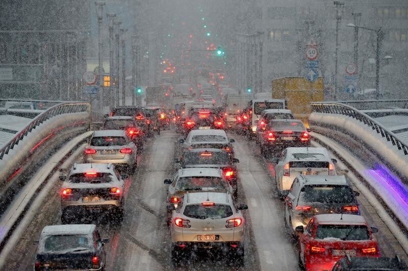 Cars are seen stuck in a traffic jam during snowfall in Brussels, Belgium, December 11, 2017.