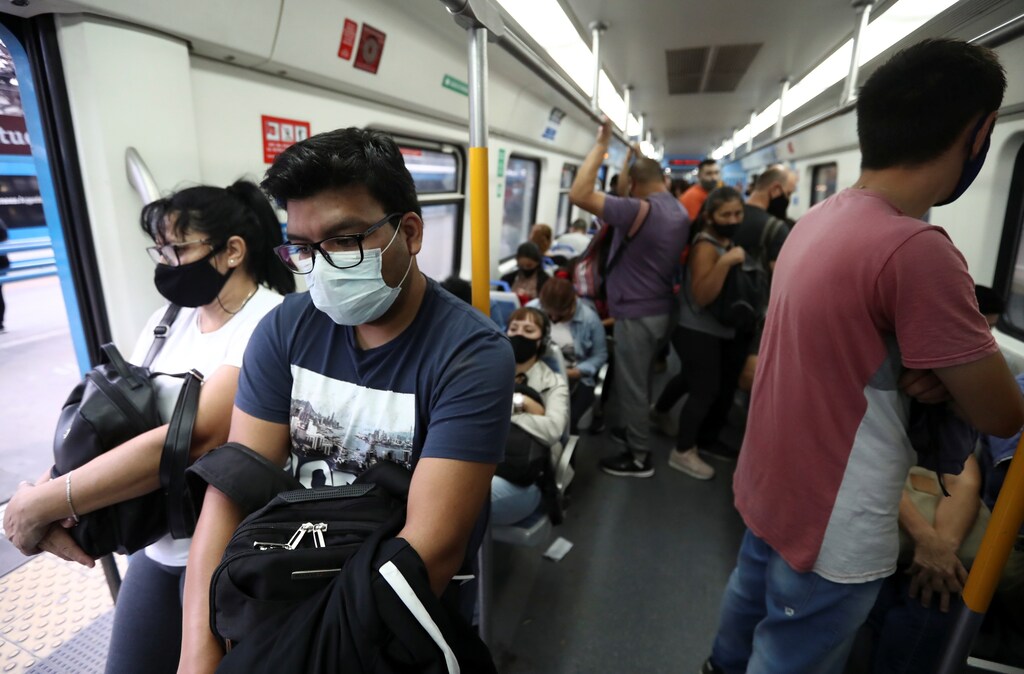 Passengers wearing face masks are seen inside a train at Constitucion train station, amid a rise in cases of the coronavirus disease (COVID-19), in Buenos Aires, Argentina April 8, 2021.