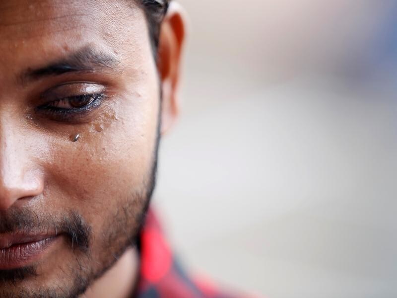Tears are seen in the eyes of a Muslim man after applying kohl to his eyelid as he arrives for a mass prayer during Eid al-Fitr to mark the end of the holy fasting month of Ramadan, in Kathmandu, Nepal, June 26, 2017.