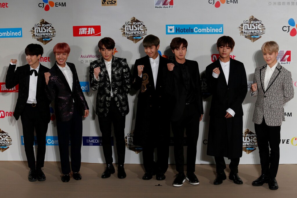 Members of South Korean K-pop band BTS, also known as Bangtan Boys, pose on the red carpet during Mnet Asian Music Awards (MAMA) in Hong Kong, China December 2, 2016. REUTERS/Bobby Yip - RC17EB9A17A0