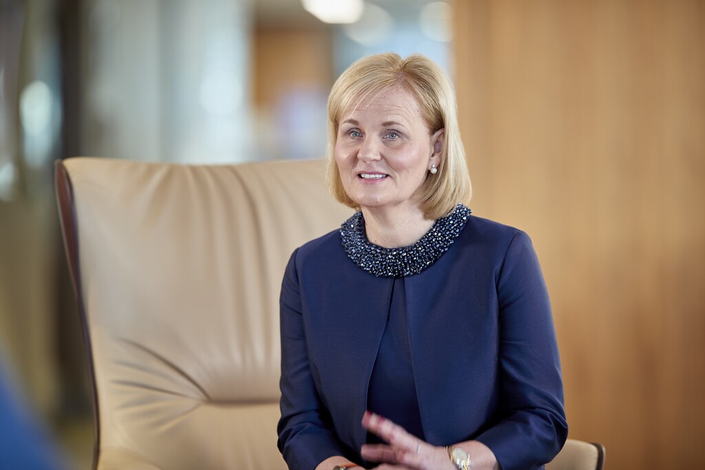 CEO of British insurer Aviva, and chair of a climate change action group Amanda Blanc sits on a chair.